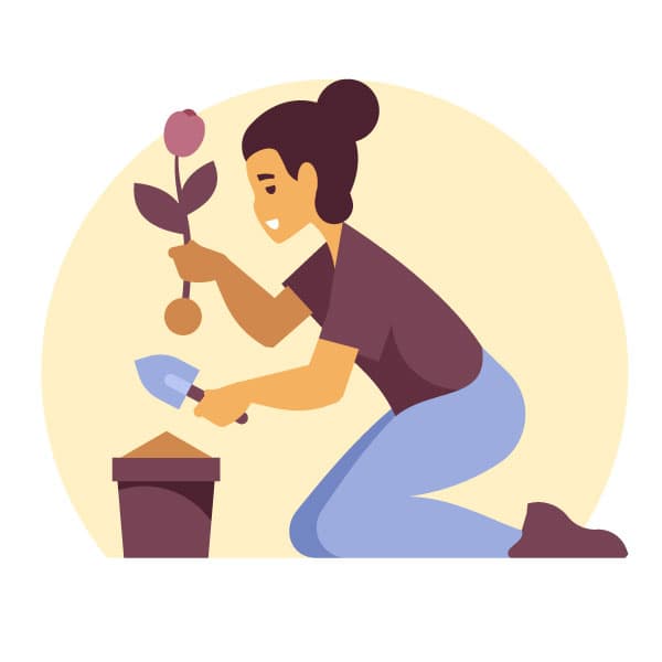 Woman planting a flower