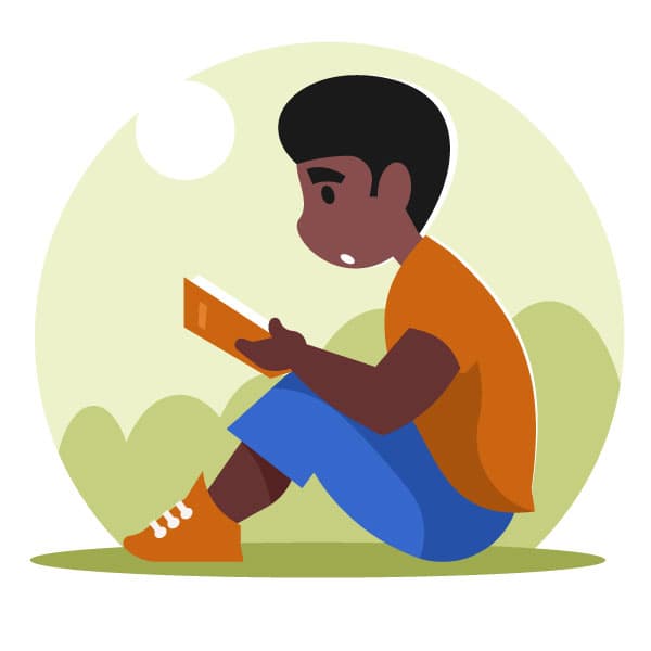 Kid reading a book in the park