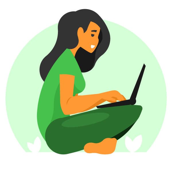 A woman is working on her laptop